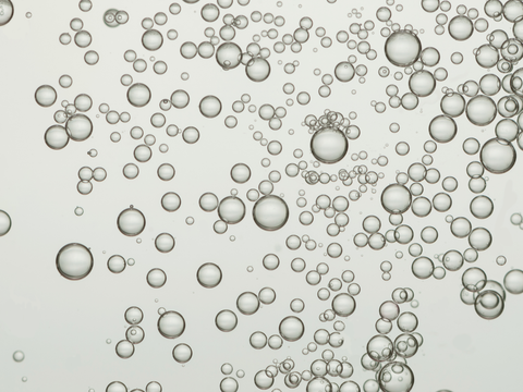 serum texture with bubbles, suitable for hydration and skin resilience, main ingredient hyaluronic acid, no packaging shown