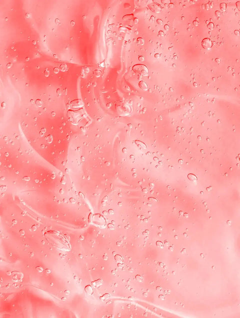 Pink skincare gel texture with bubbles, highlighting hydration concern, hyaluronic acid main ingredient, no packaging shown.