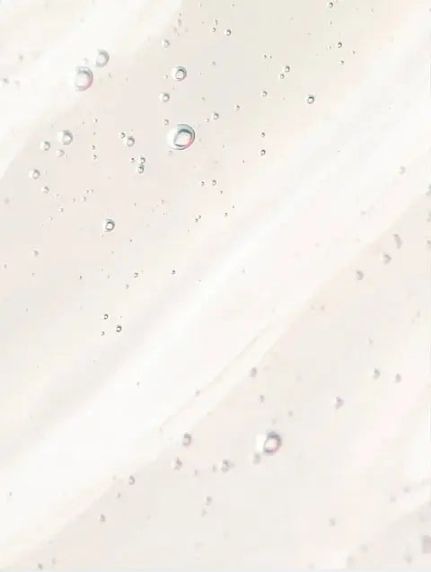 Clear skincare gel with air bubbles, highlighting hydration focus and smooth texture