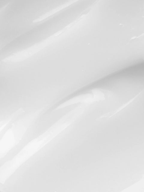 Smooth white eye cream texture, for under-eye concerns, with botanical ingredients, no visible packaging