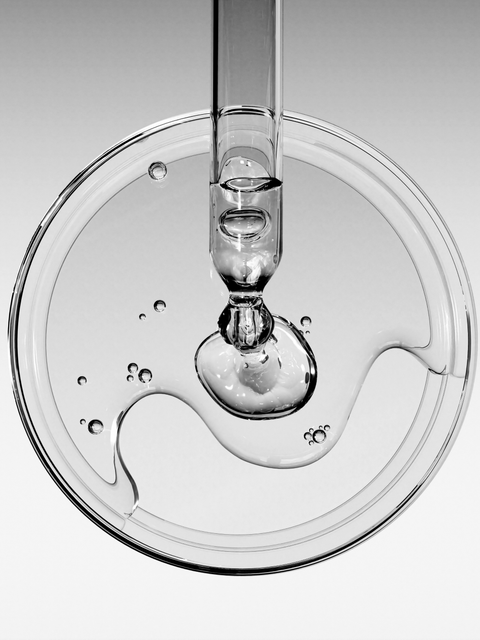 Clear serum with hyaluronic acid for hydration, shown in glass dropper packaging